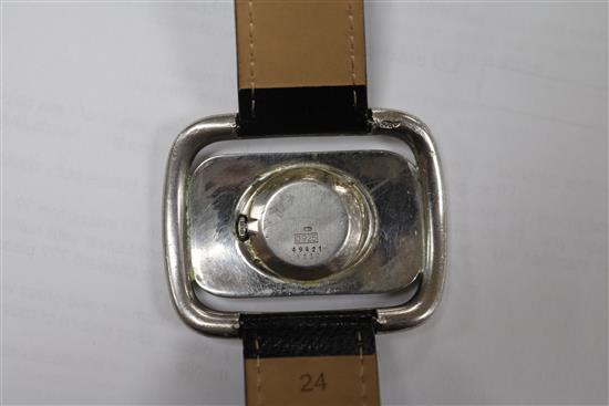 A silver Chopard Geneve manual wind buckle wrist watch.